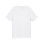 Minimal white organic cotton t-shirt with “nothing extra” text by ELVAE, clean everyday essential. Front